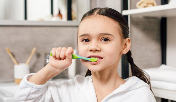  When should the baby brush their teeth?